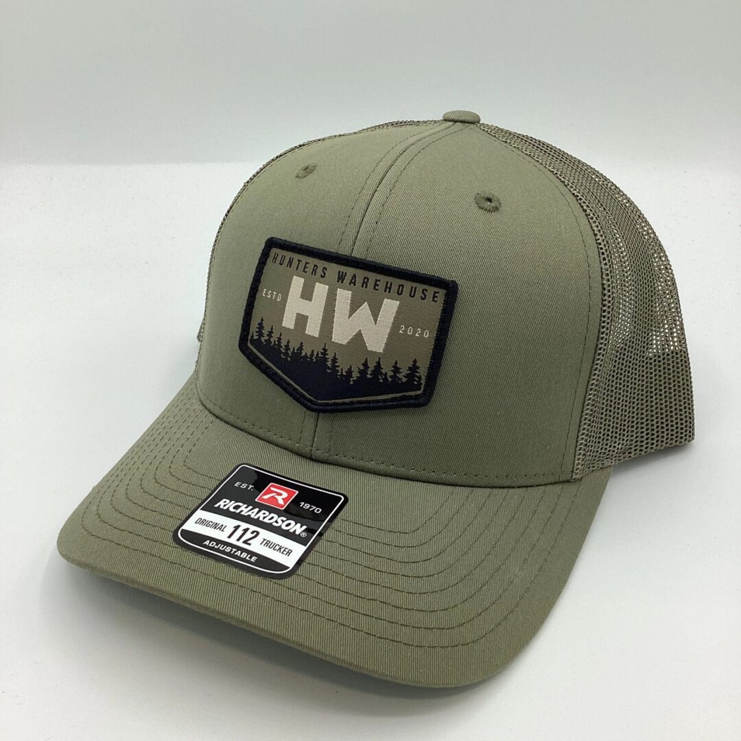 Green and gray mesh trucker hat with HW logo patch.